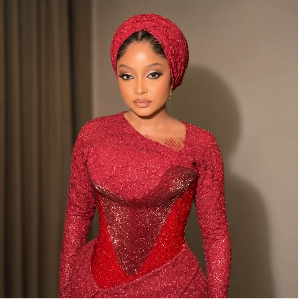 Crimson lace gown with matching gele headwrap, African fashion made to order in Columbus